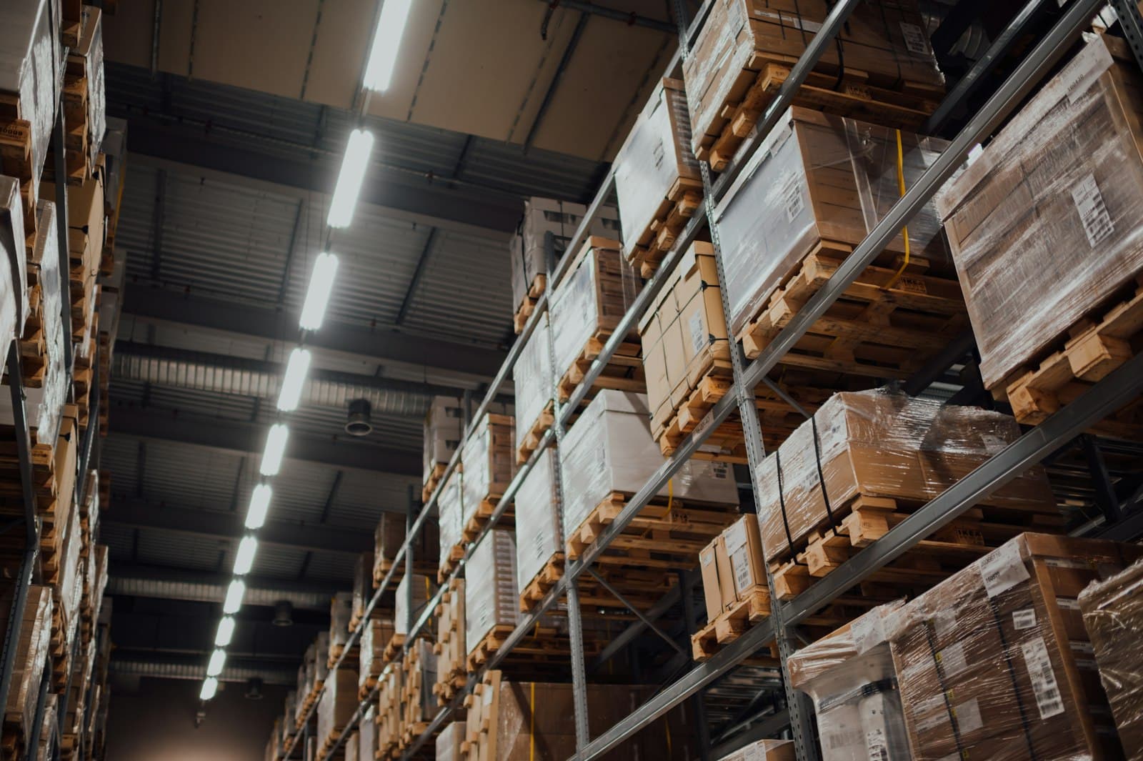 Pallets of packaged goods racked in a storage warehouse